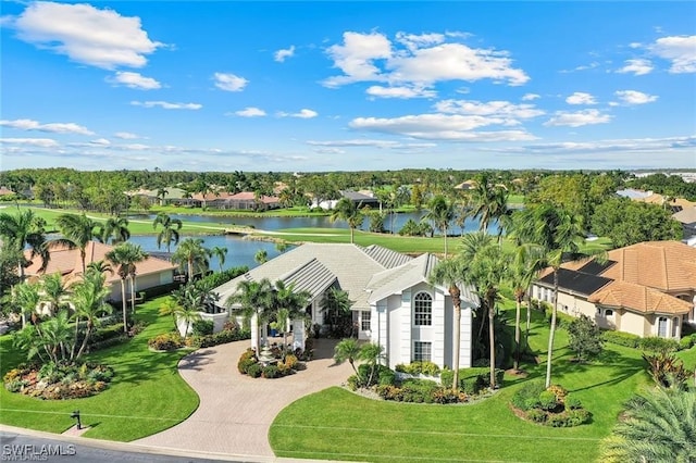 birds eye view of property with a water view