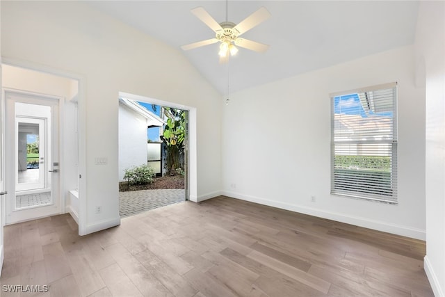 spare room featuring ceiling fan, light hardwood / wood-style flooring, and vaulted ceiling