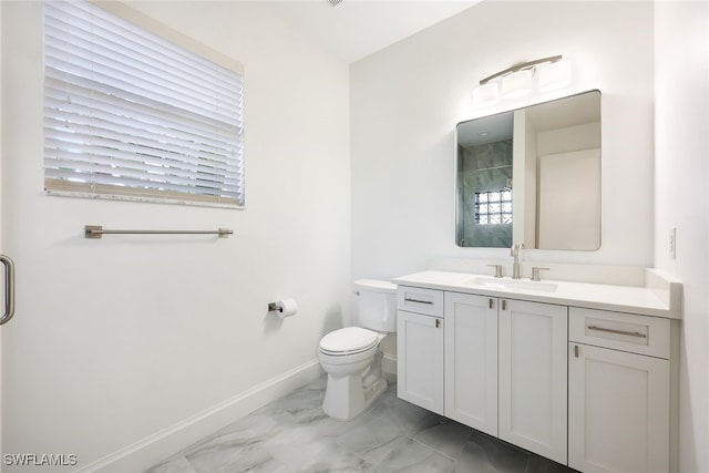 bathroom with vanity, toilet, and an enclosed shower