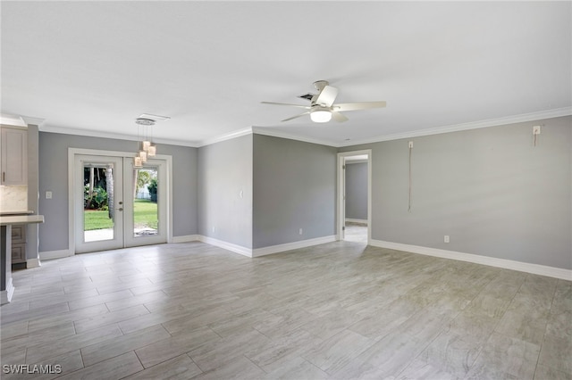 unfurnished room with french doors, ceiling fan, and crown molding