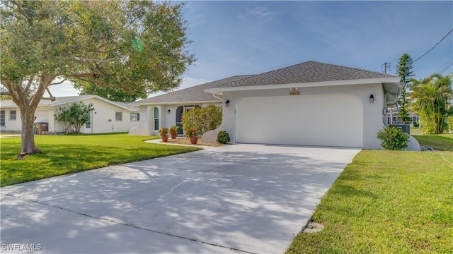 ranch-style house with a garage and a front lawn