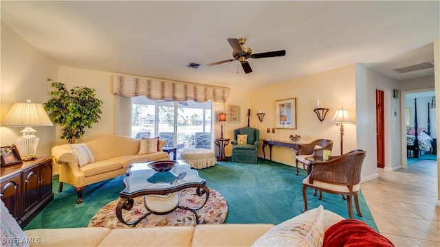 living room with ceiling fan and light tile patterned floors