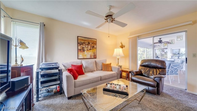 carpeted living room featuring ceiling fan