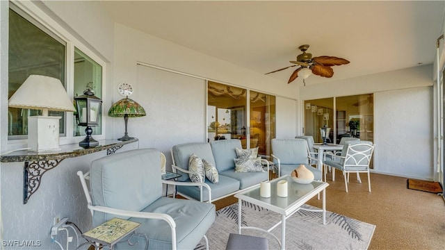 sunroom / solarium with ceiling fan