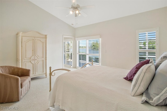 bedroom featuring vaulted ceiling, light carpet, and ceiling fan