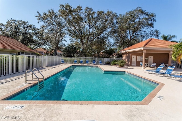 view of swimming pool with a patio