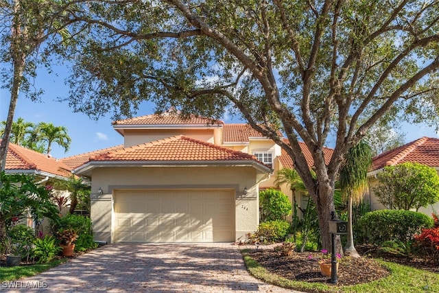 mediterranean / spanish-style house featuring a garage