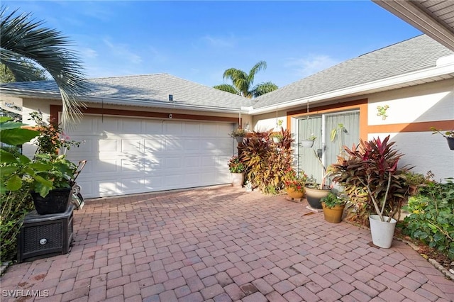 view of front of home with a garage