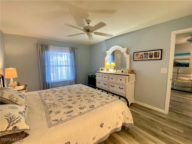 bedroom featuring ceiling fan and light hardwood / wood-style flooring