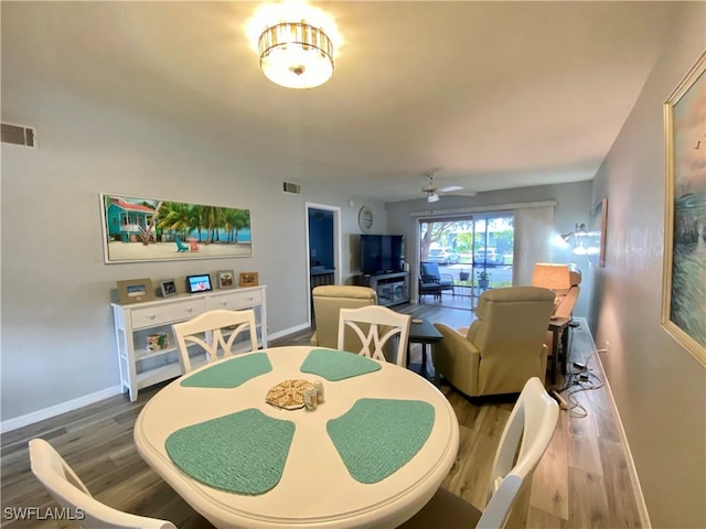 dining room featuring hardwood / wood-style flooring and ceiling fan