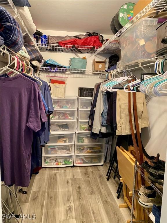 walk in closet featuring hardwood / wood-style floors