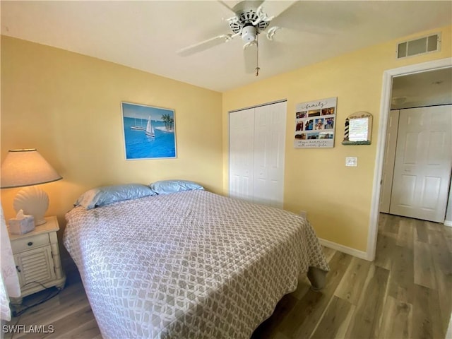 bedroom featuring wood-type flooring, a closet, and ceiling fan