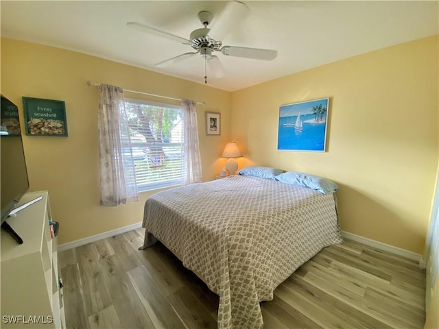 bedroom featuring ceiling fan and light hardwood / wood-style floors