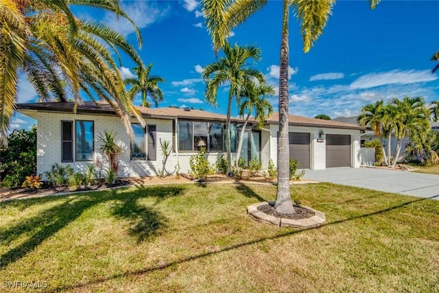 ranch-style home with a garage and a front yard