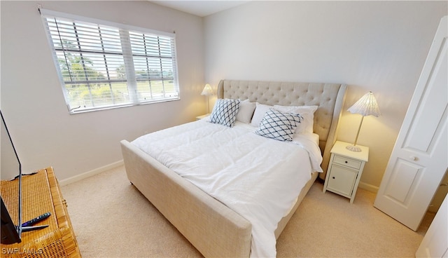 bedroom with light colored carpet