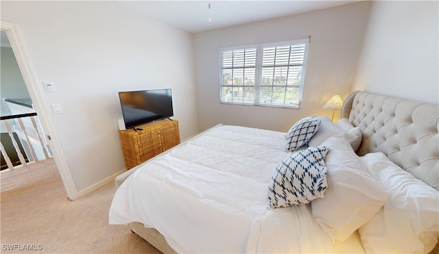 bedroom with light colored carpet