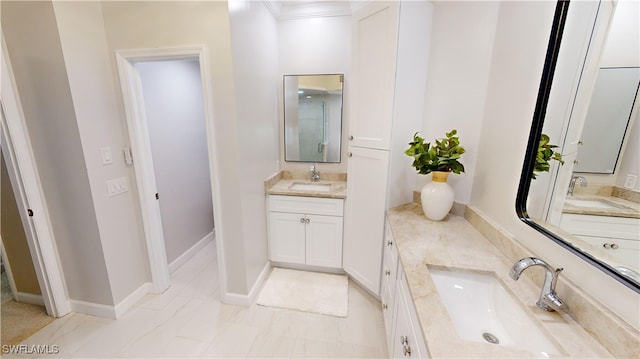 bathroom with crown molding and vanity