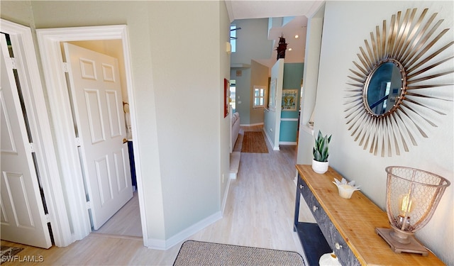 hallway with light hardwood / wood-style flooring