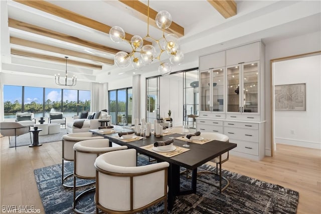 dining room featuring beamed ceiling, a notable chandelier, and light hardwood / wood-style floors