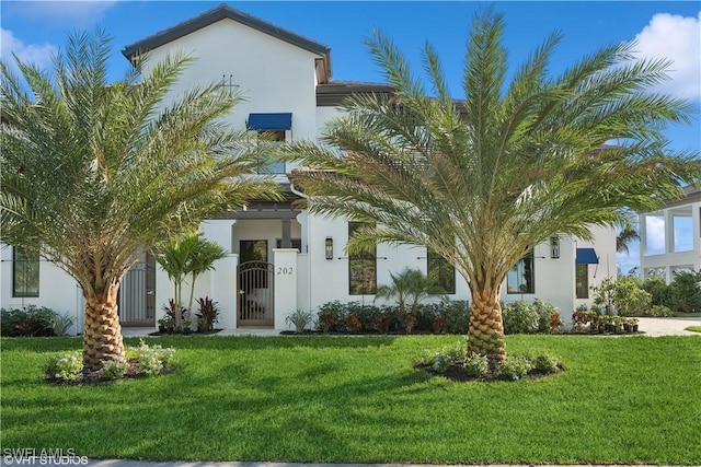 view of front of home with a front yard