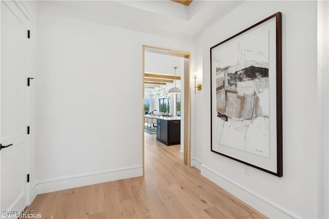 hallway with light hardwood / wood-style flooring