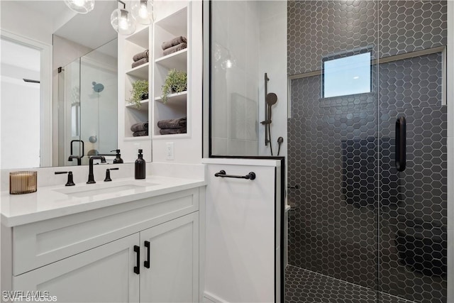 bathroom featuring vanity and a shower with shower door