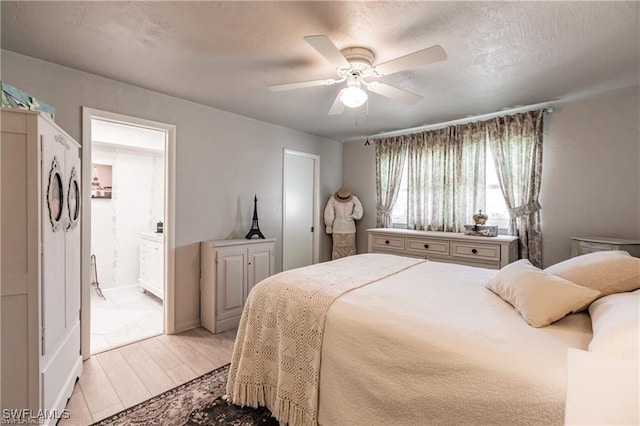 bedroom featuring ceiling fan and ensuite bathroom