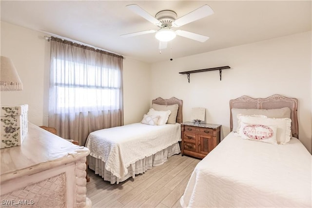 bedroom featuring ceiling fan and light wood-type flooring