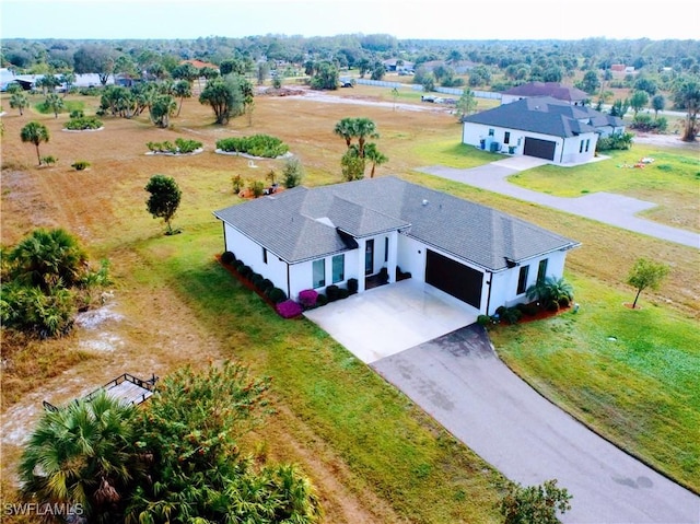 birds eye view of property with a rural view