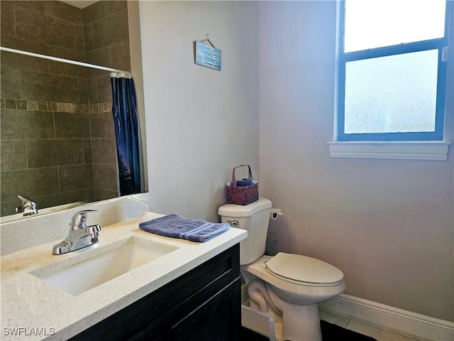 bathroom with tile patterned flooring, a shower with curtain, vanity, and toilet