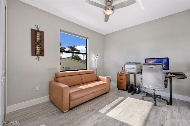 office space with ceiling fan and light hardwood / wood-style floors