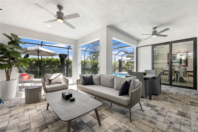 sunroom featuring ceiling fan