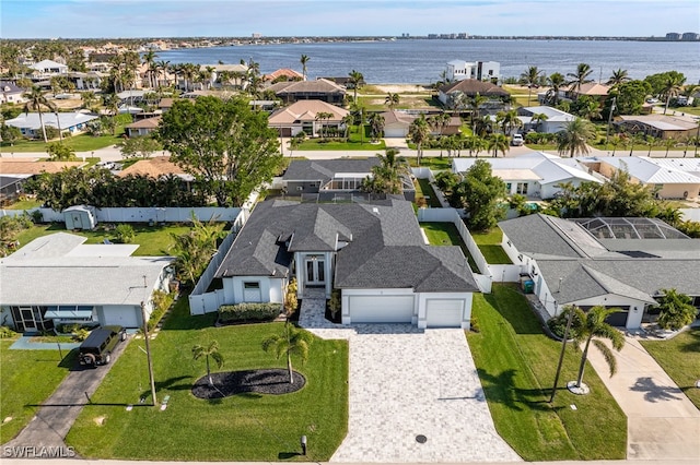 birds eye view of property featuring a water view