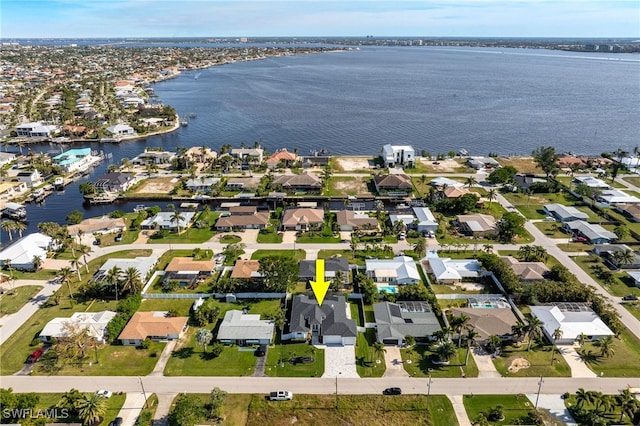 birds eye view of property featuring a water view