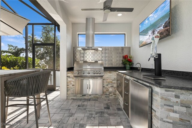 interior space featuring decorative backsplash, ceiling fan, sink, exhaust hood, and fridge