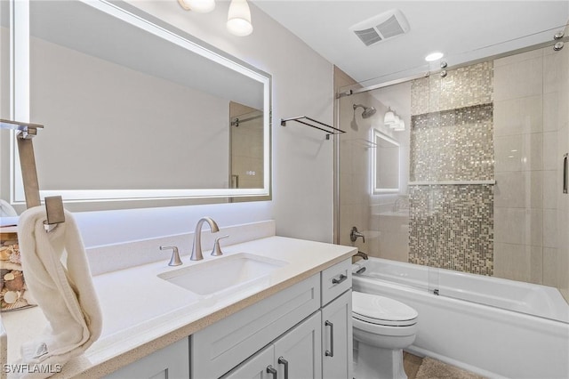 full bathroom with vanity, enclosed tub / shower combo, and toilet