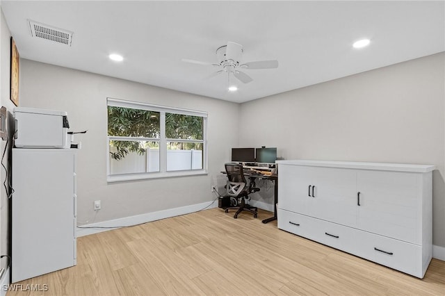 office area with ceiling fan and light hardwood / wood-style floors