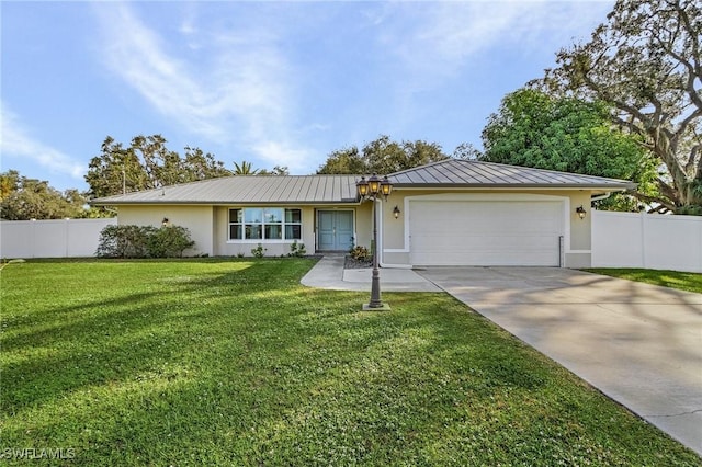 ranch-style home featuring a garage and a front yard