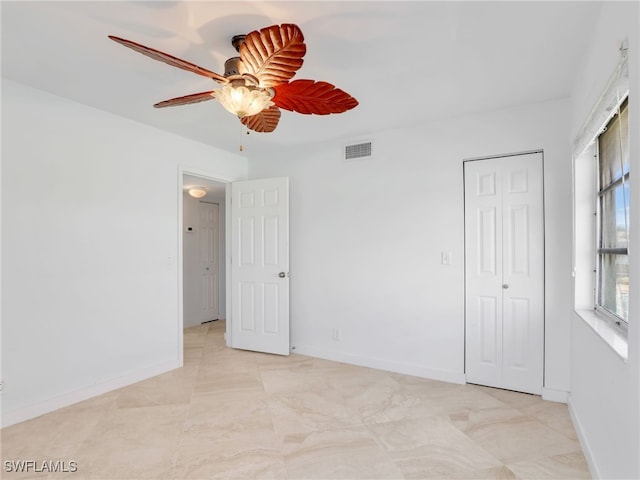 unfurnished bedroom with a closet and ceiling fan