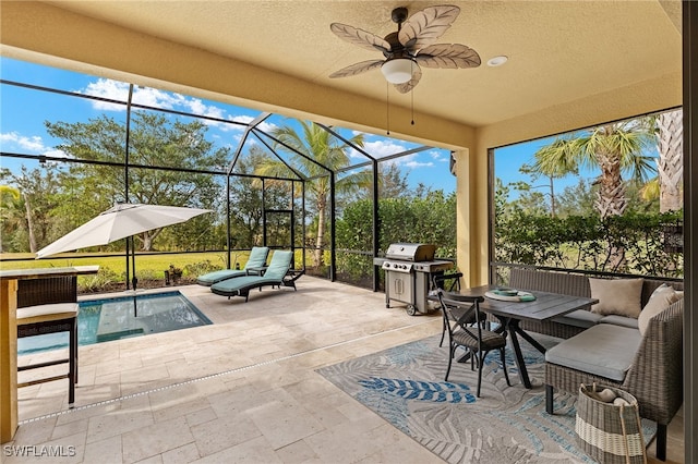 view of patio featuring an outdoor living space, grilling area, ceiling fan, and a lanai