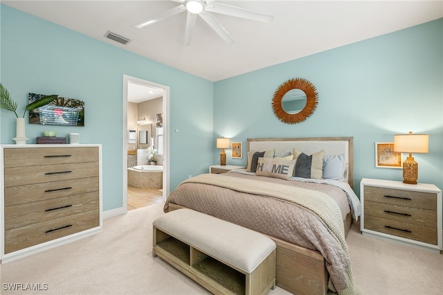 carpeted bedroom with connected bathroom and ceiling fan