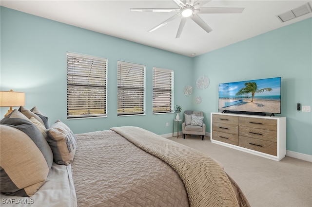 bedroom featuring light colored carpet and ceiling fan