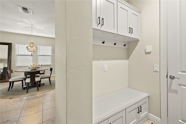 mudroom with light tile patterned floors