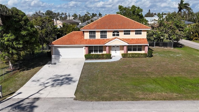 view of front of home featuring a front yard and a garage