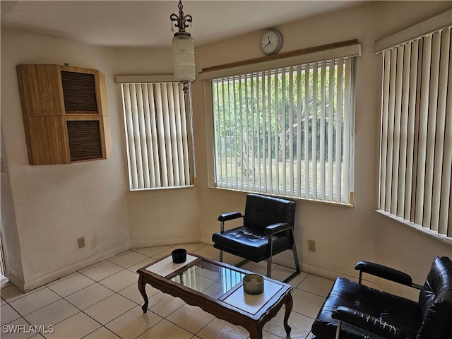 living area featuring light tile patterned floors and a wealth of natural light