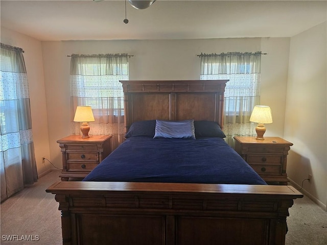 bedroom featuring light colored carpet