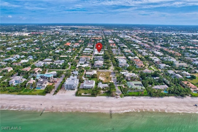 aerial view featuring a water view and a beach view