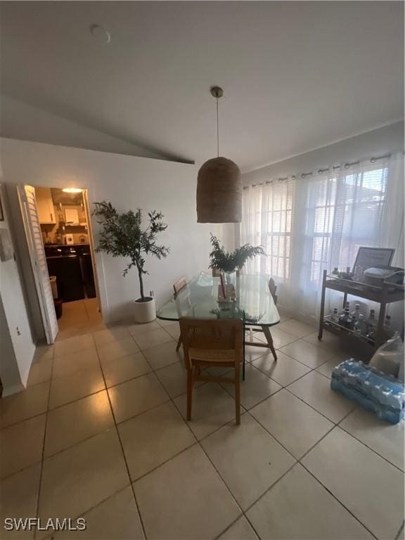 dining space with tile patterned flooring