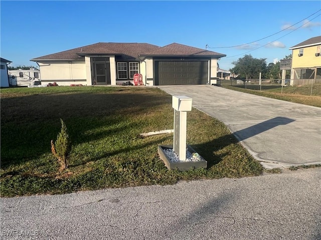 view of front facade featuring a front yard and a garage