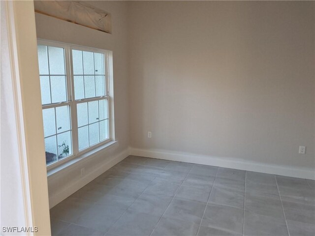 empty room with baseboards